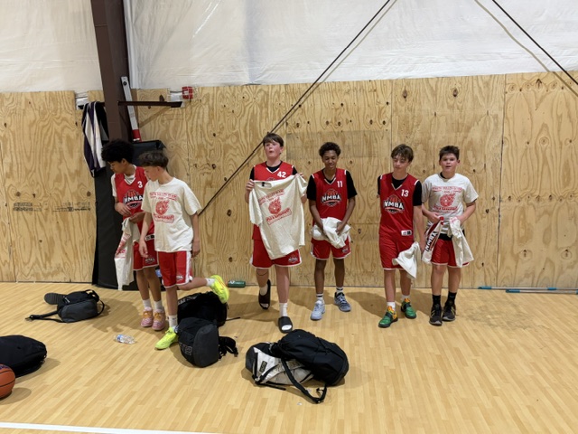 Players with championship shirts after a Kingmaker tournament